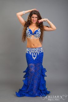 Royal blue costume with white pearls